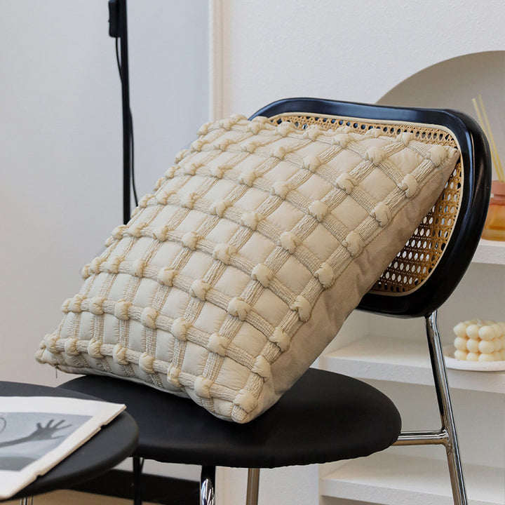 Square cushion cover made of textured bouclé blend with decorative piped seam Kalsten