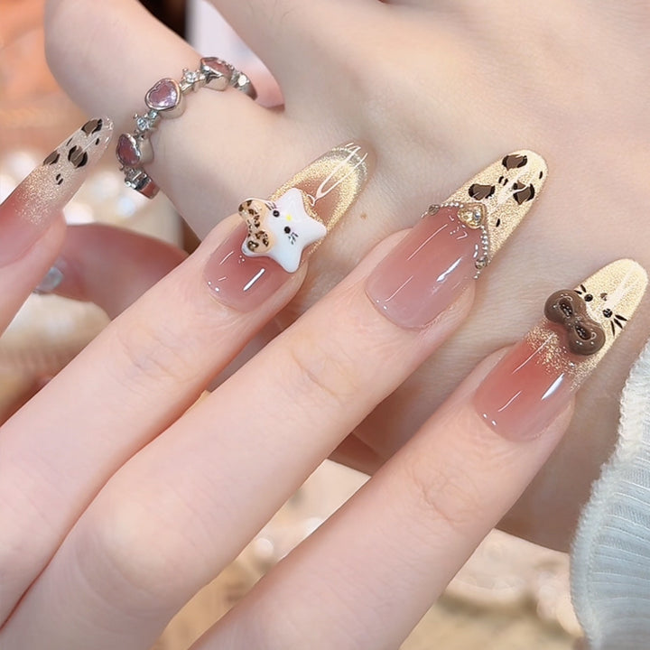 Artificial nail set with festive gift design and elegant glitter accents Kalsten