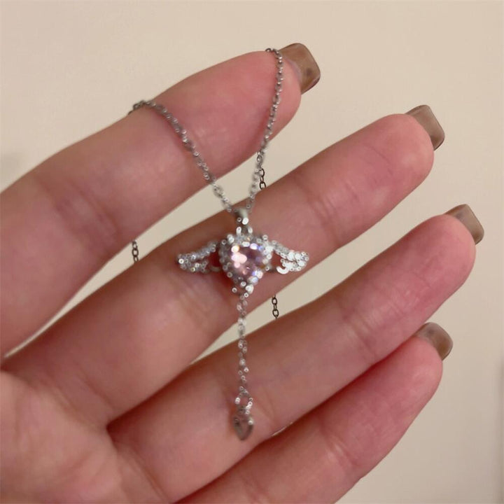 Playful angel neck chain with heart and wings Kalsten