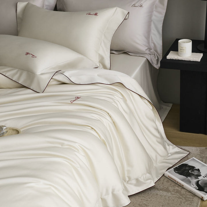 Bedding set made of fine satin with a silky-smooth finish and embroidered logo