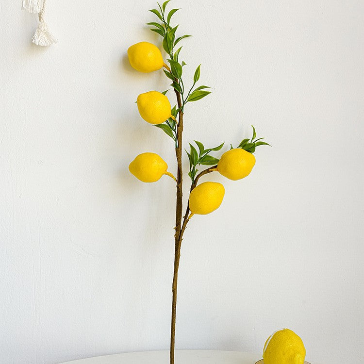 Decorative branch with artificial lemons