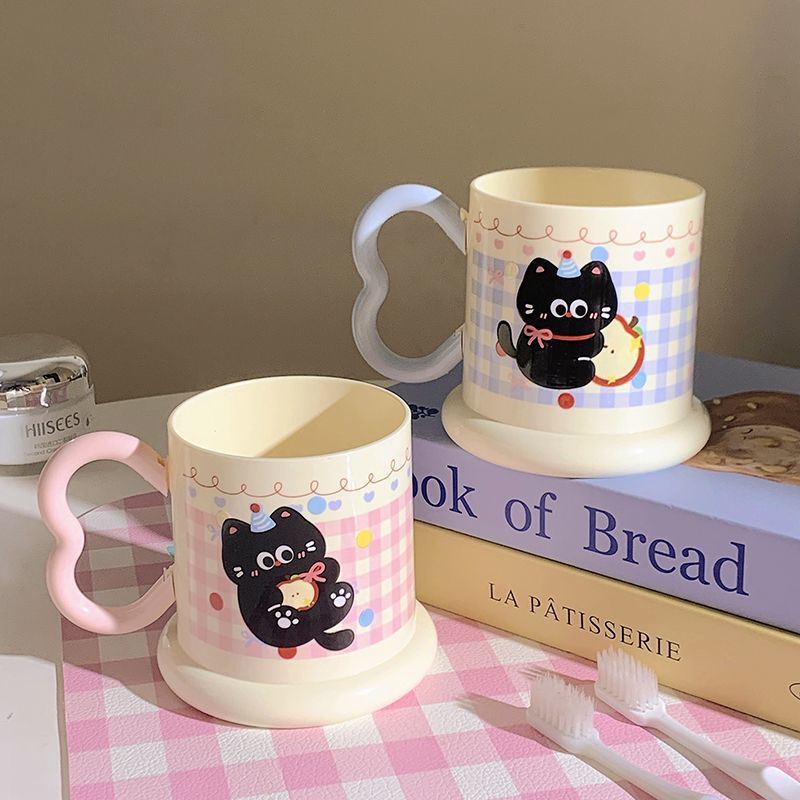 Ceramic mug with playful cat motif Kalsten