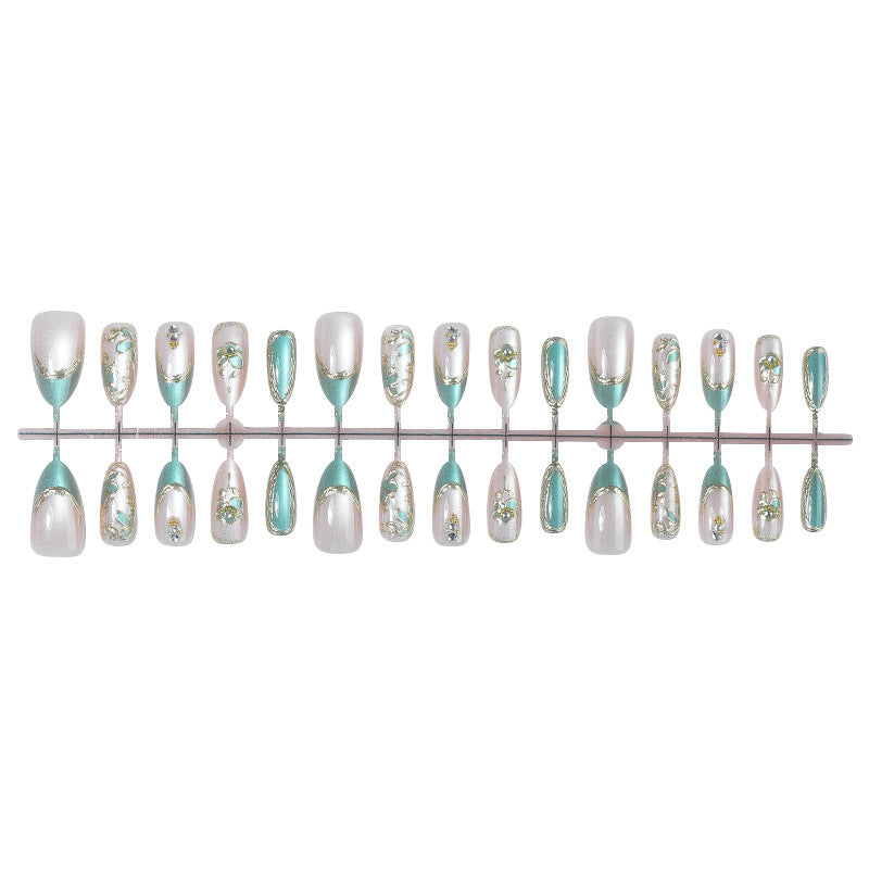 Artificial nail set with luxurious flower appliqués and glitter accents Kalsten