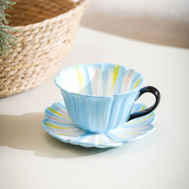 Handcrafted ceramic mug with shell-shaped wave edge and contrasting handle