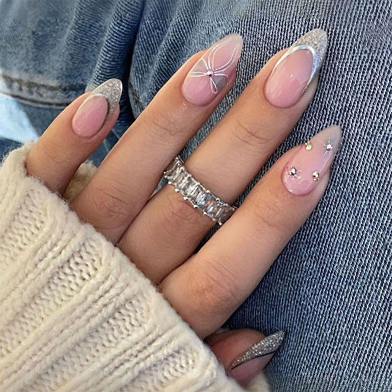 Artificial nail set with glamorous glitter and flower accents Kalsten