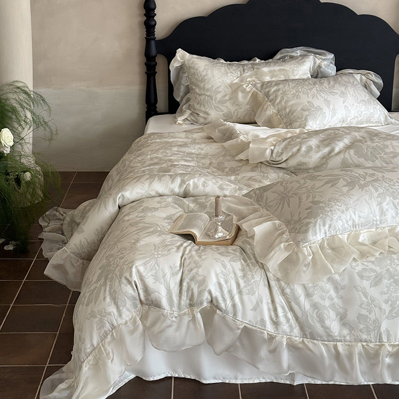 Elegant bedding set made of fine satin jacquard with delicate floral relief and decorative ruffle