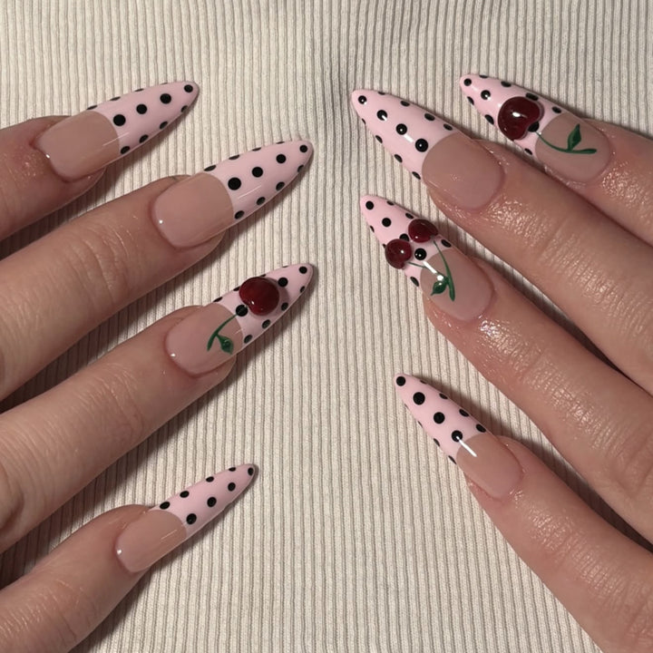 Artful stiletto nails with elegant floral design and glitter details Kalsten