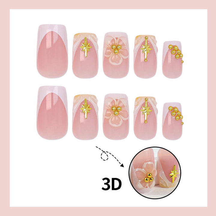 Nail set with delicate flower and gold embellishments Kalsten