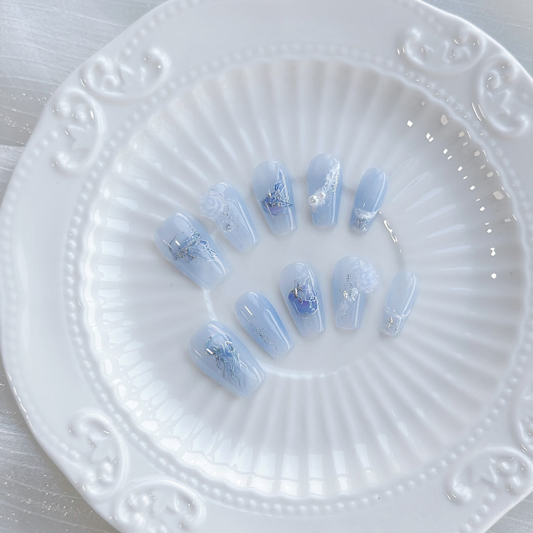 Artistic Press-On Nail Set with Sea-Inspired Designs