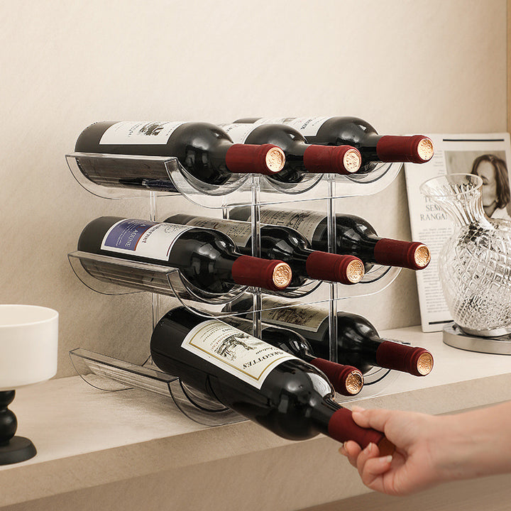 Stackable acrylic wine bottle holder with curved cavities for nine standard bottles
