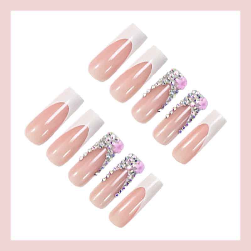 Art nail set with elegant glitter and floral accents Kalsten