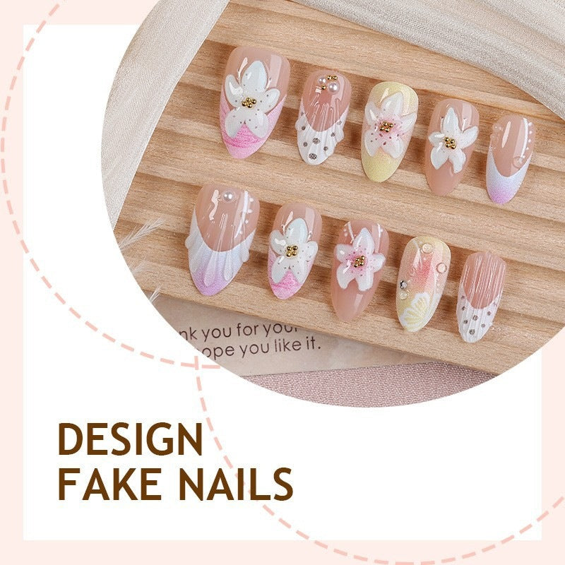 Artificial nail set with delicate floral designs and elegant accents Kalsten