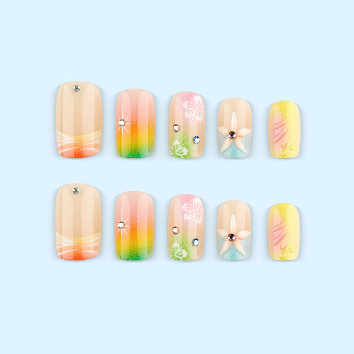 Artificial nails in vibrant floral design with glitter accents Kalsten