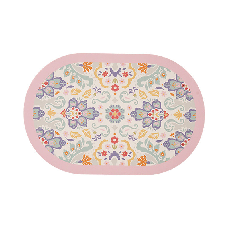 Oval table mat made of wipeable cotton-linen mix with intricate floral print