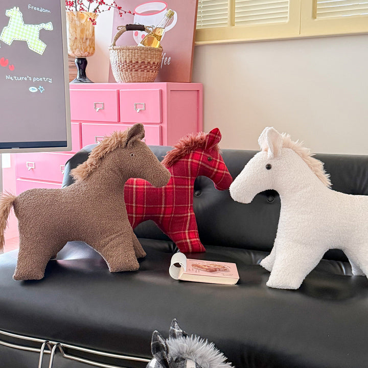 Decorative cuddle horse made of teddy fleece as a decorative and play cushion