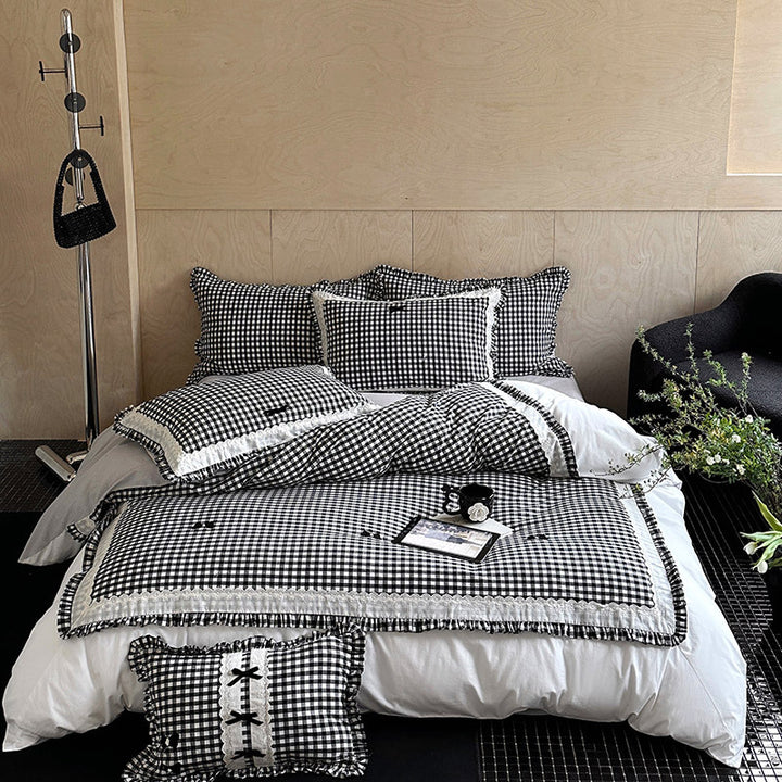 Bedding set in country house style with Vichy check, ruffle and embroidery appliqués