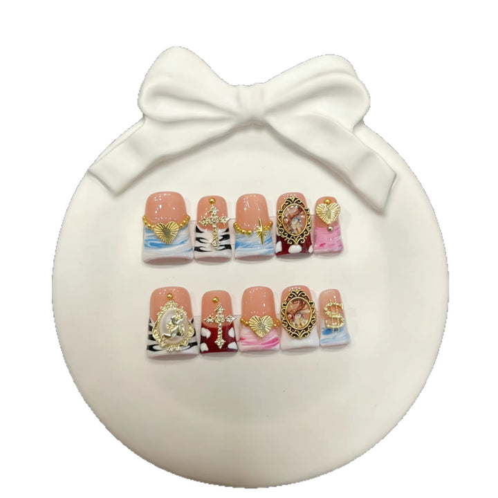 Artistic Press-On Nail Set with Gold Accents and Unique Designs