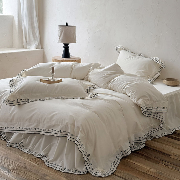 Luxurious embroidered bedding set with ruffled hem
