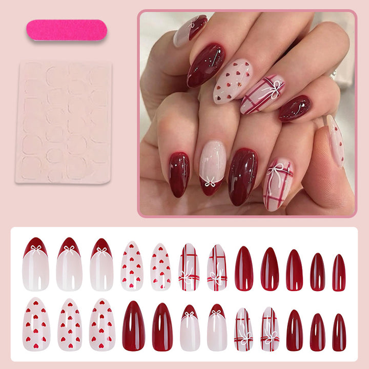 Nail set with playful hearts and elegant bows Kalsten