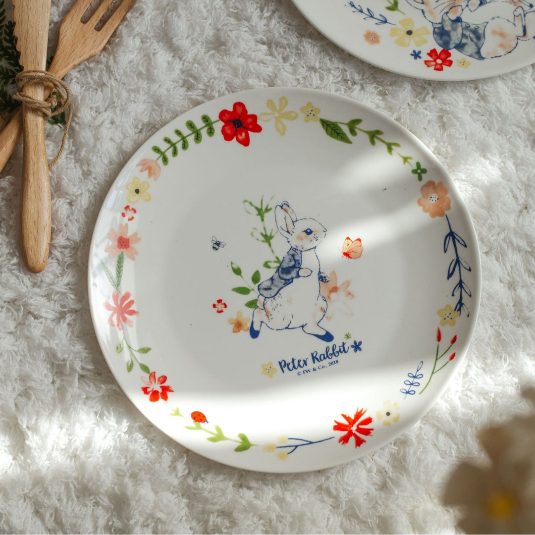 Children's plate made of porcelain with rabbit illustration and floral decoration