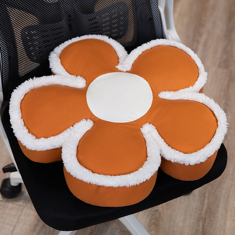 Padded seat cushion in flower shape with faux leather center piece and fluffy edge padding
