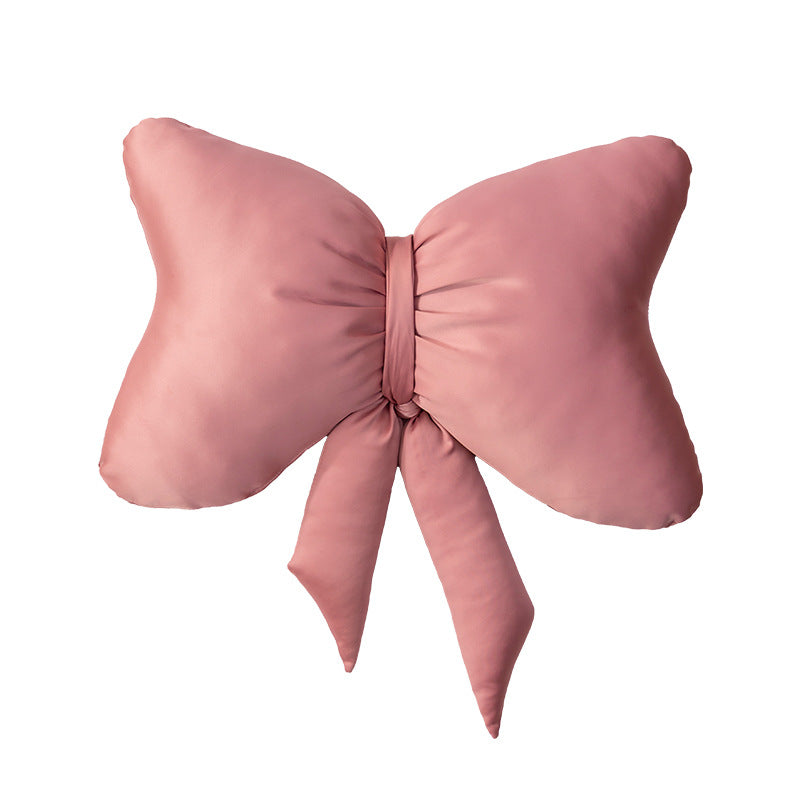 Decorative bow accent cushion with soft-touch cover