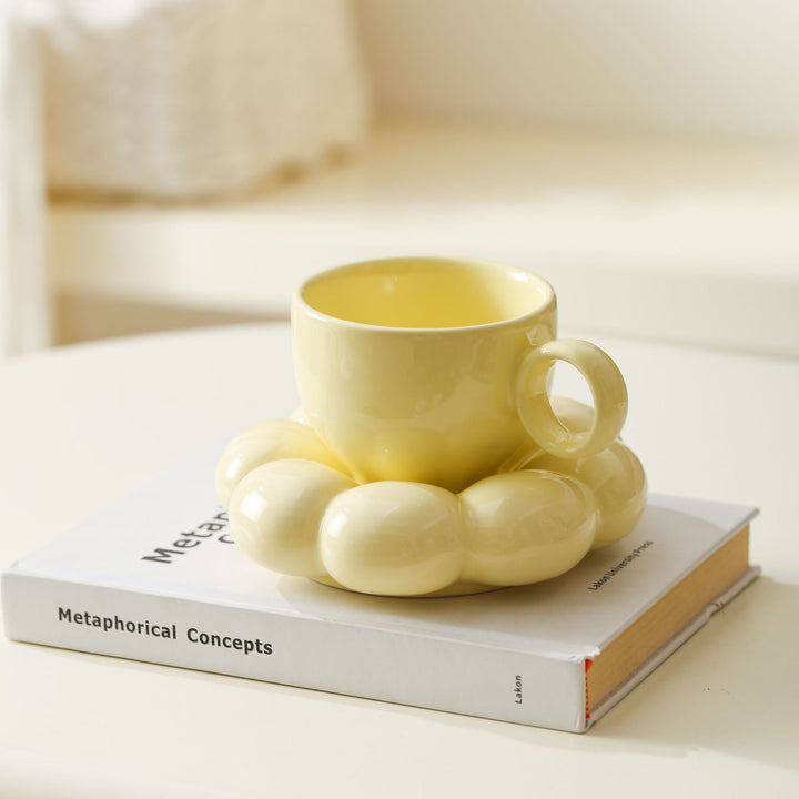 Ceramic mug with sculptural bubble saucer
