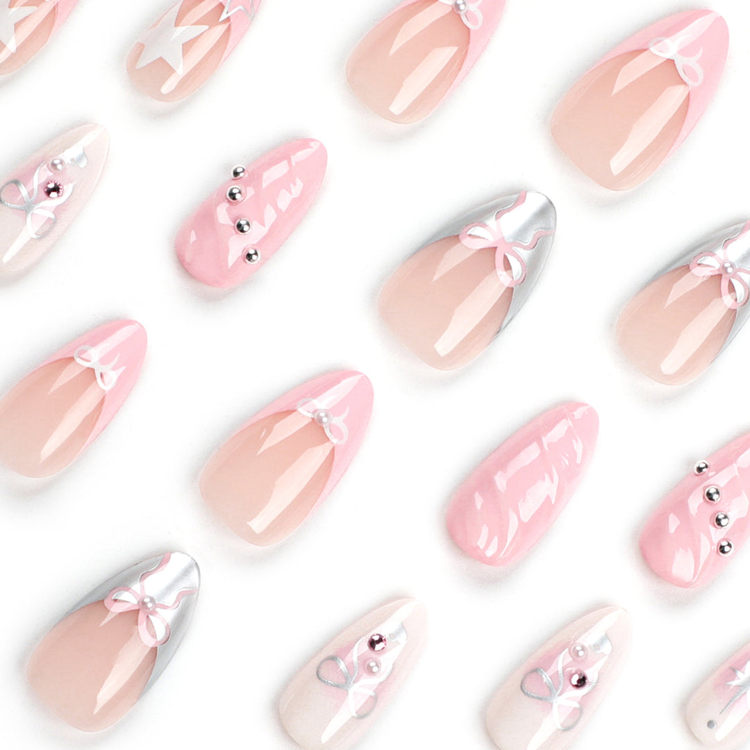 Artistic Nail Art with decorative bows and glitter accents Kalsten