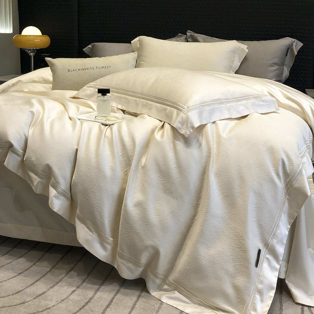 Premium cotton satin bedding set with structured matelassé border and hotel closure