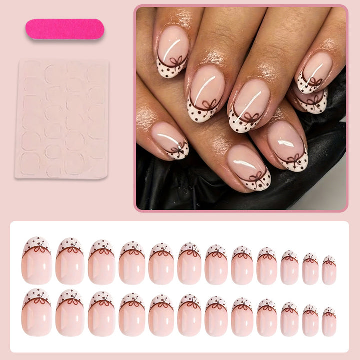 Artificial nail set with elegant bow and dot patterns Kalsten