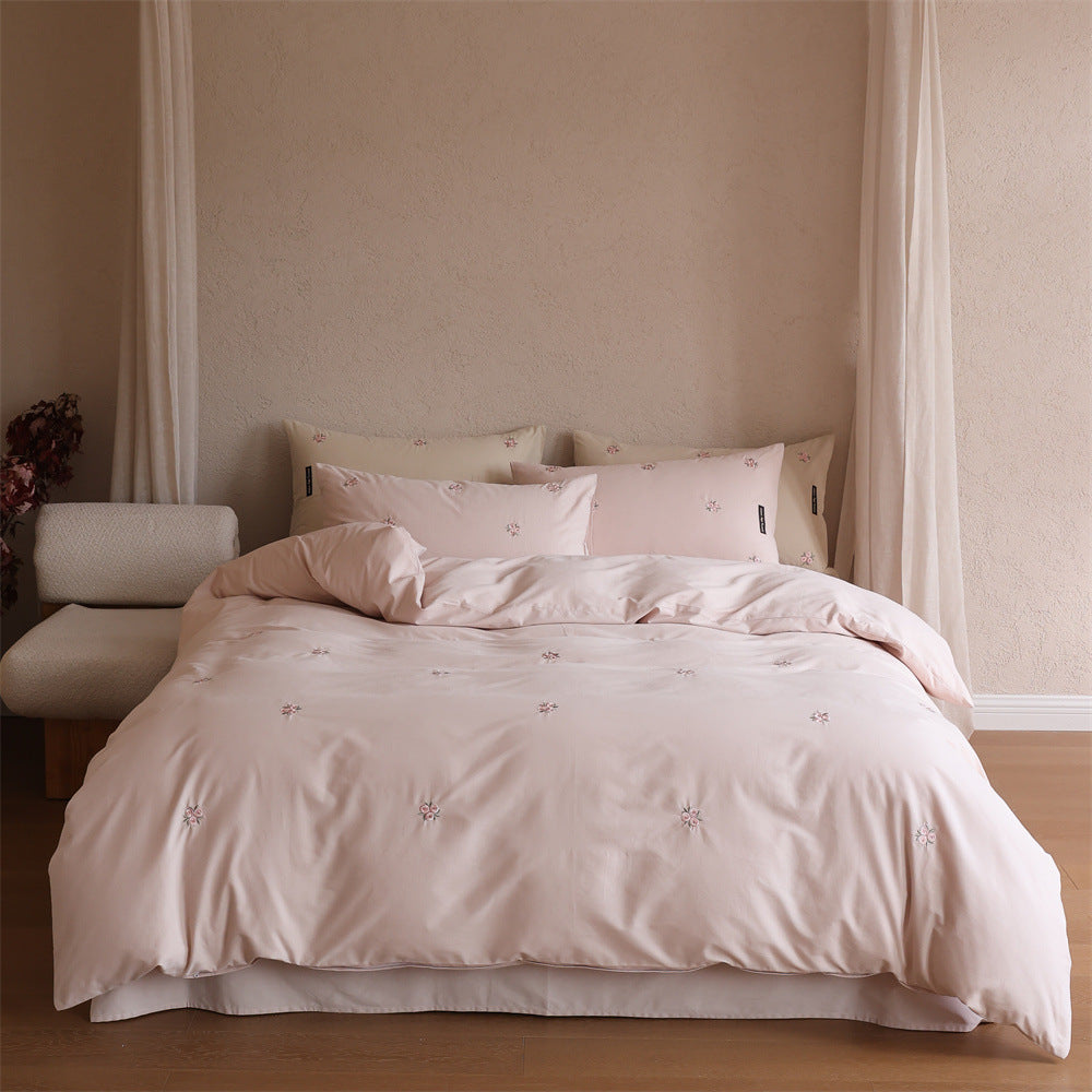 Embroidered cotton satin bedding set with subtle floral embroidery