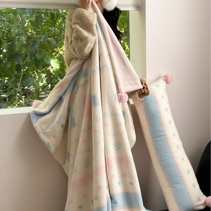 Soft blanket made of microfleece with pompom and Nordic bear pattern