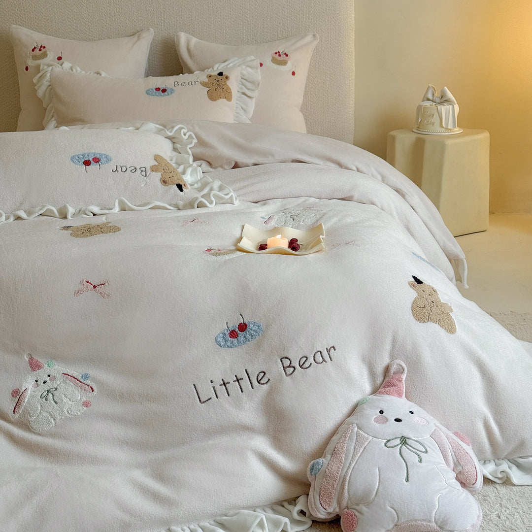 Quilted bedding set with ruffle and medallion relief