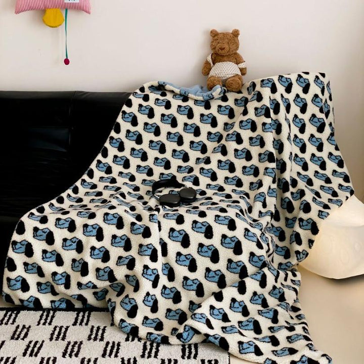 Plush Sherpa throw blanket with abstract pattern and extra-soft teddy fleece