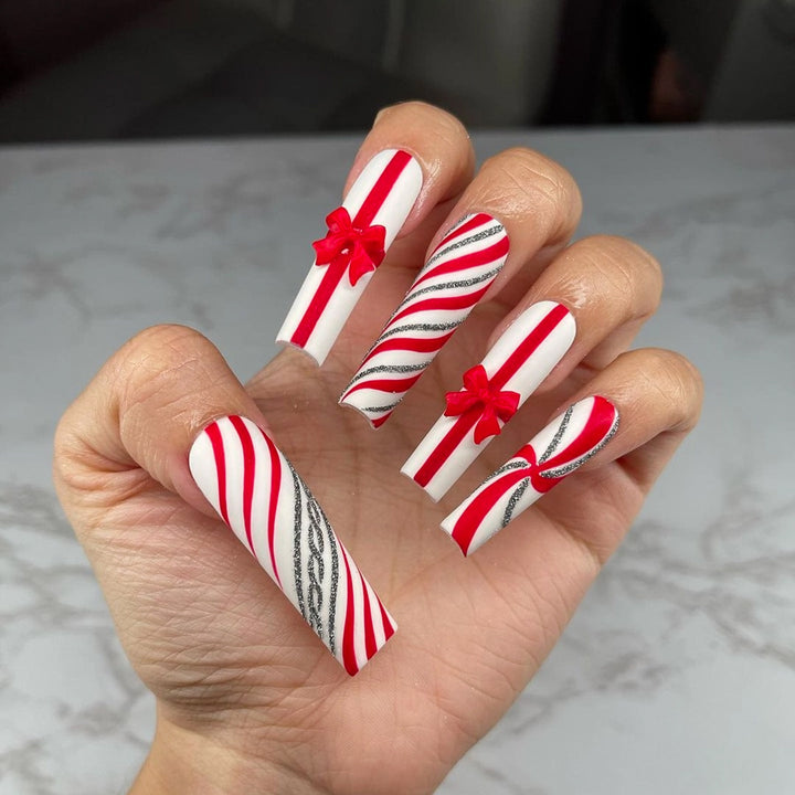 Artful Nail Art with Festive Bows and Christmas Motifs Kalsten