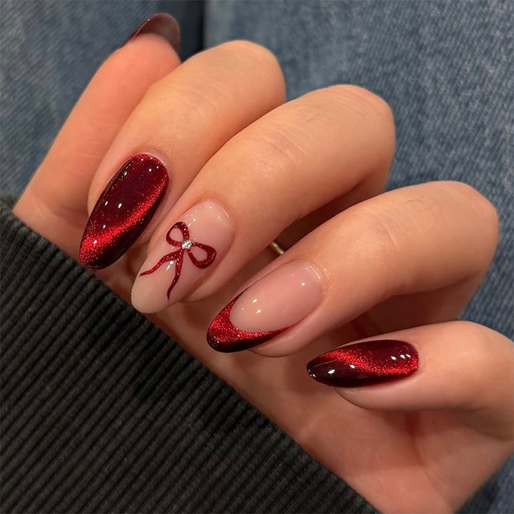 Glamorous artificial nail set with glitter effects and elegant bow motifs Kalsten