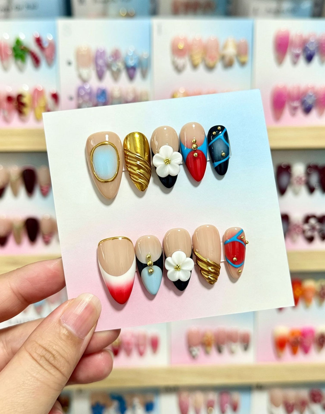 Artistic Press-On Nail Set with Floral and Green Accents