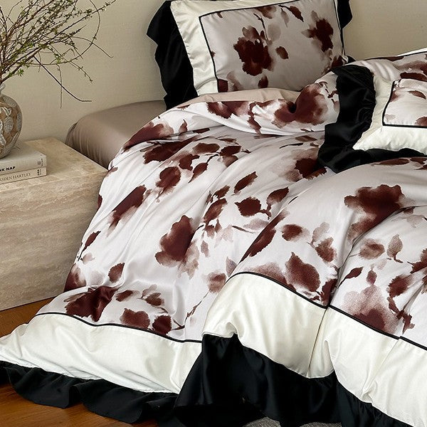Luxury bed cover set made of cotton satin with abstract watercolor flower print and contrasting ruffle