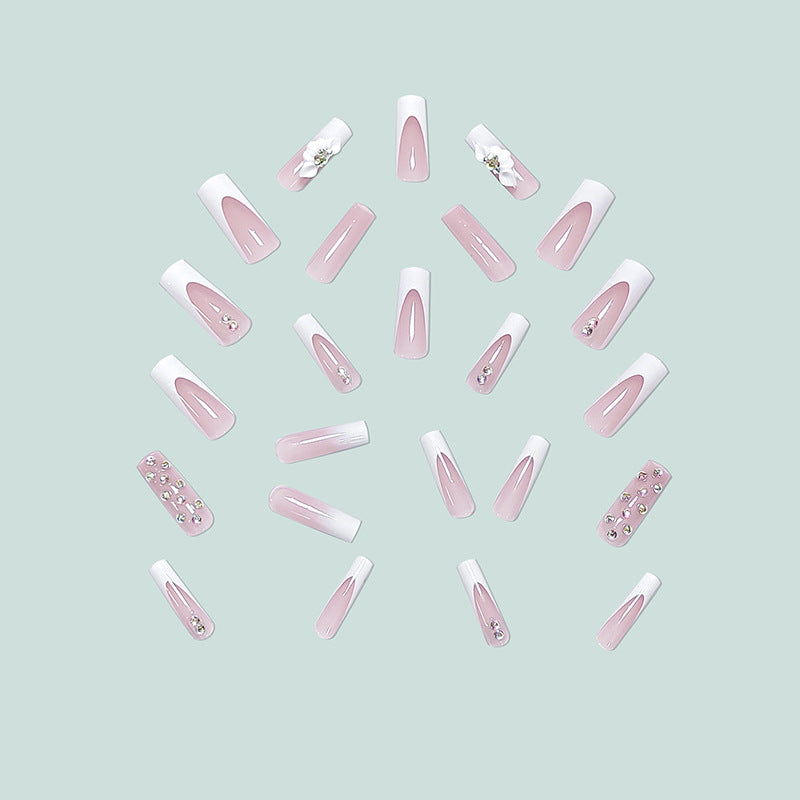 Artful stiletto nails with floral accents and rhinestone details Kalsten