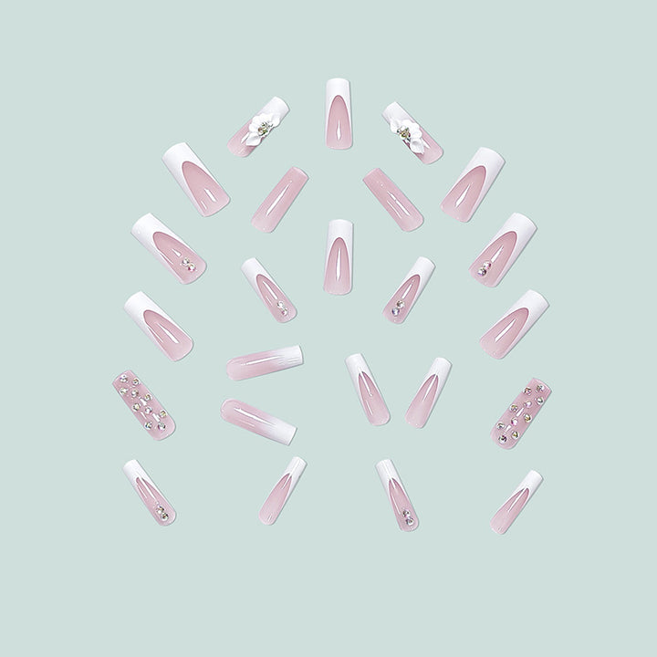 Artful stiletto nails with floral accents and rhinestone details Kalsten