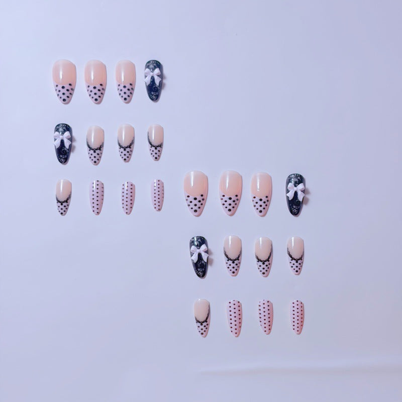Elegant artificial nails with lace design and bow accents Kalsten