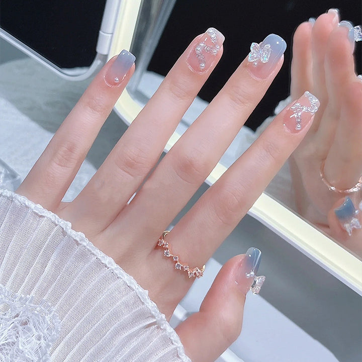 Acrylic nail set with sparkling glitter elements and appealing ombre design Kalsten