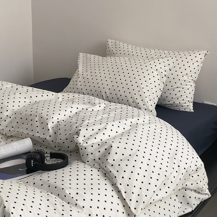 Cotton percale bedding set with minimalist polka dot pattern and hotel closure