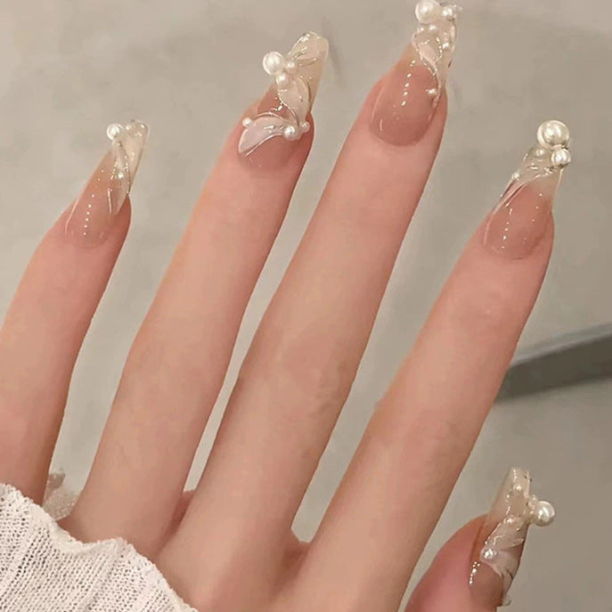 Elegant nail design with pearl embellishment Kalsten