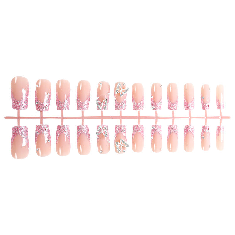 Acrylic nail set with sparkling glitter accents and elegant butterfly motifs Kalsten