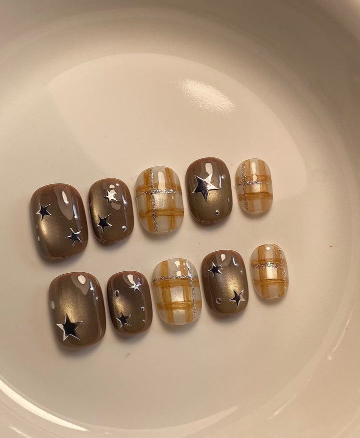 Artistic Nail Art Set with Unique Star and Plaid Designs