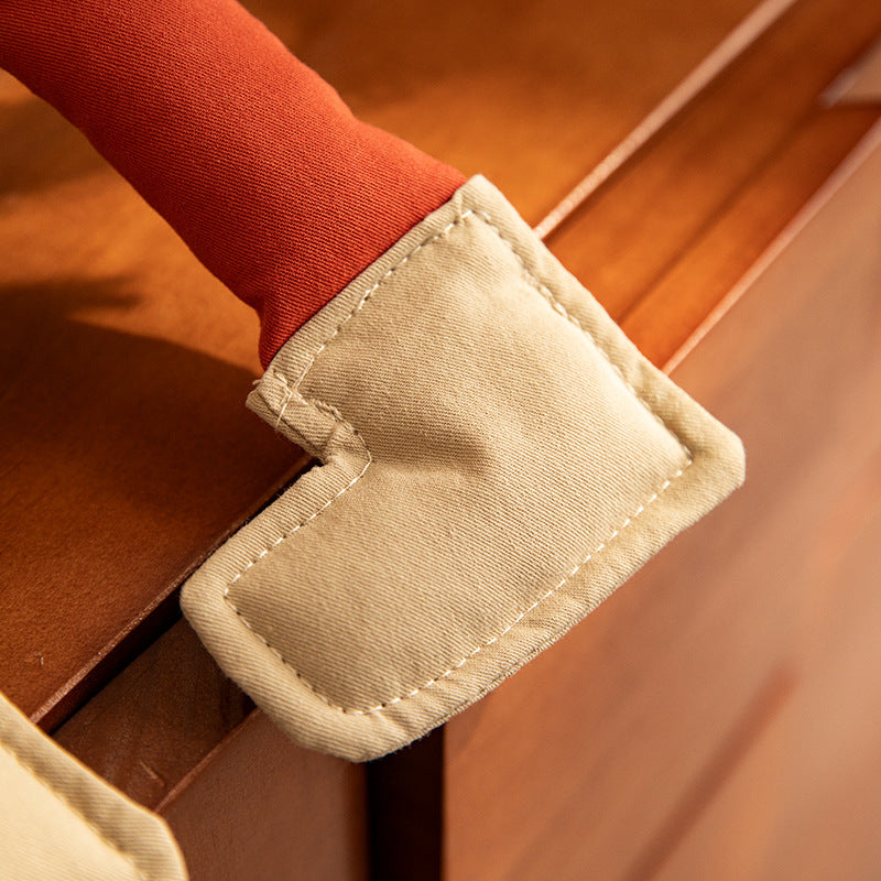 Shoulder bag with playful plush pendant and padded carrying handle