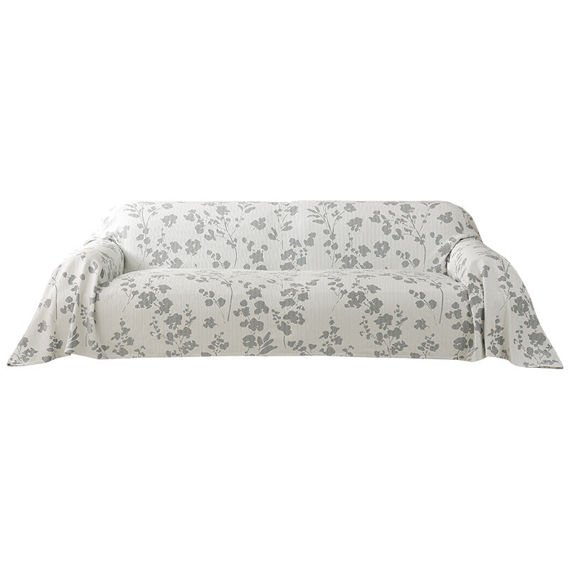Universal sofa cover with floral relief and elastic hem