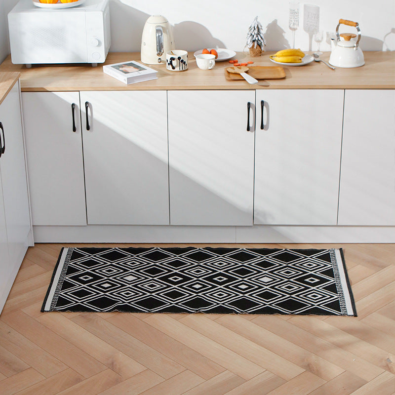 Flat-woven kitchen runner with non-slip underside and geometric diamond pattern