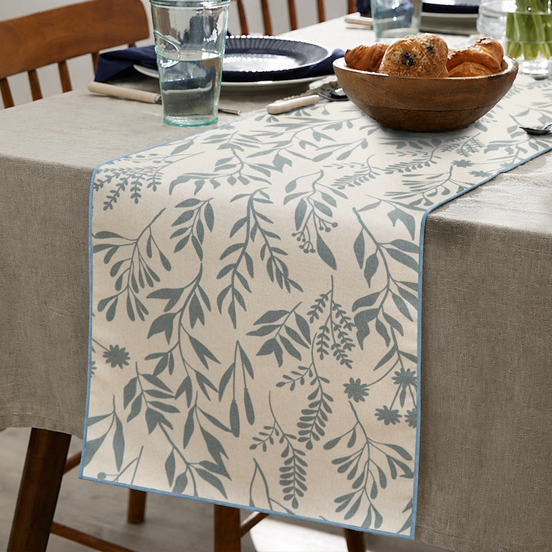 Woven table runner in botanical leaf pattern made of cotton blend Kalsten